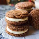 Ginger Molasses Sandwich Cookies with Eggnog Frosting