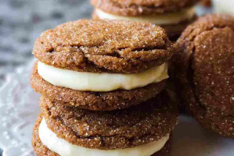 Ginger Molasses Sandwich Cookies with Eggnog Frosting